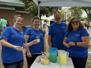 Team MNLB serving lemonade at Taste of Delano in Delano, MN.