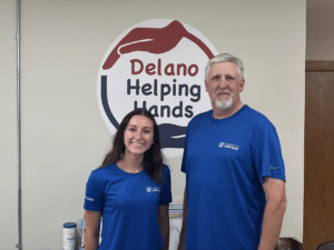 Rachel Birkholz and Brian DeBolt volunteering at Delano Helping Hands Food Shelf